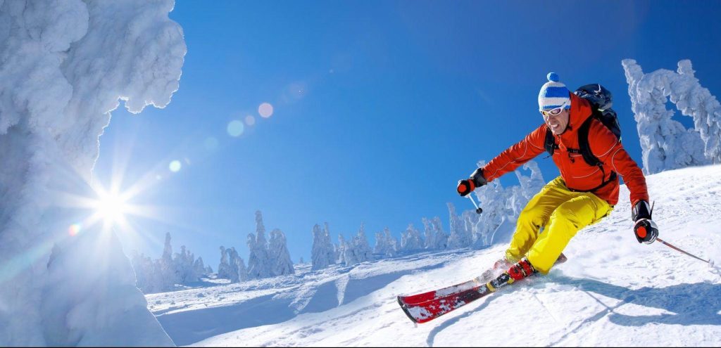 Australia 2 Skier against blue sky in high mountains
